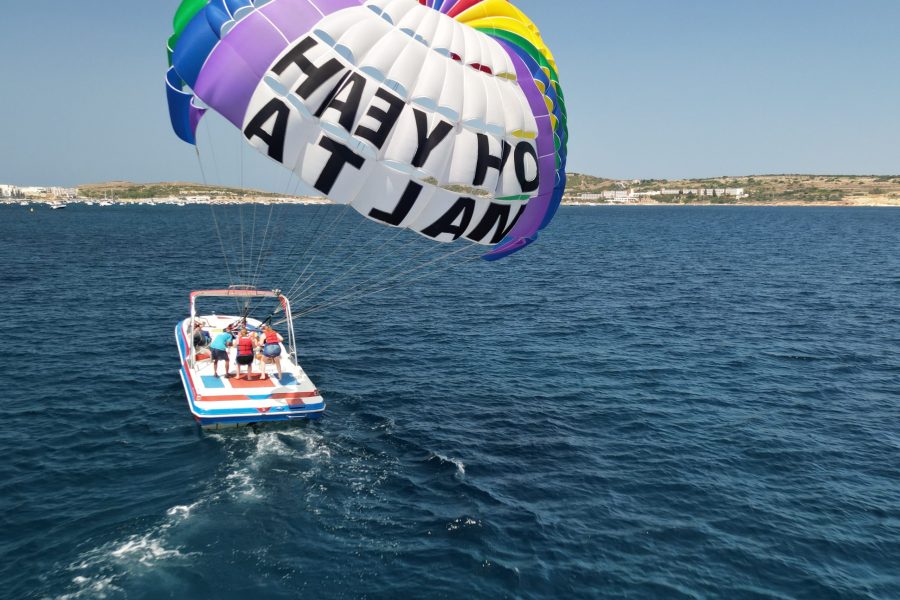 2 people doing parasailing